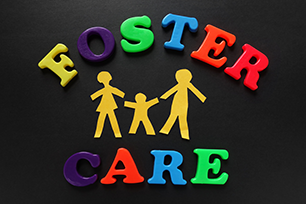 Multiple color block letters spelling foster care